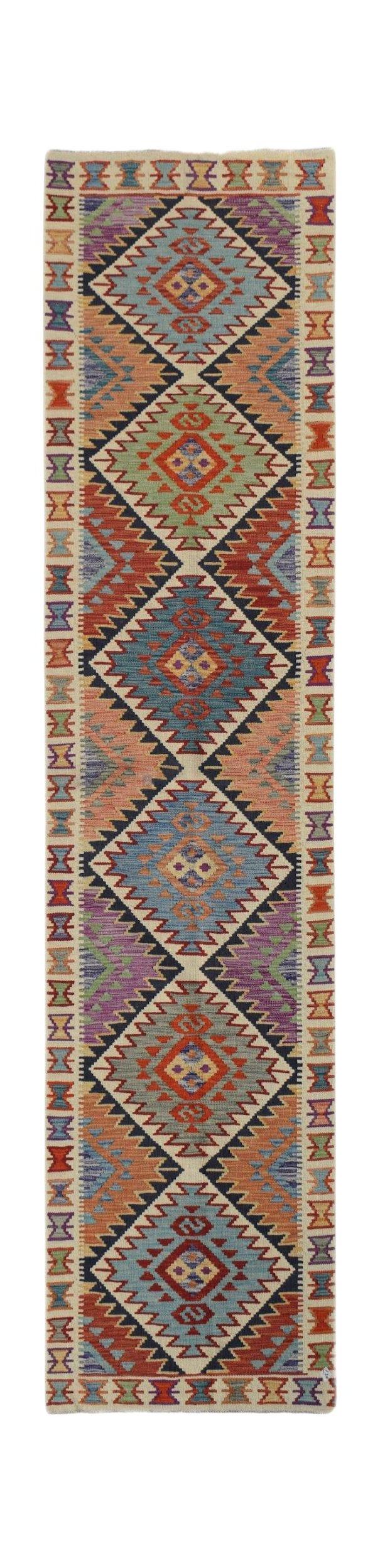 Handwoven Afghan Maimana wool runner rug featuring a colorful geometric diamond pattern.