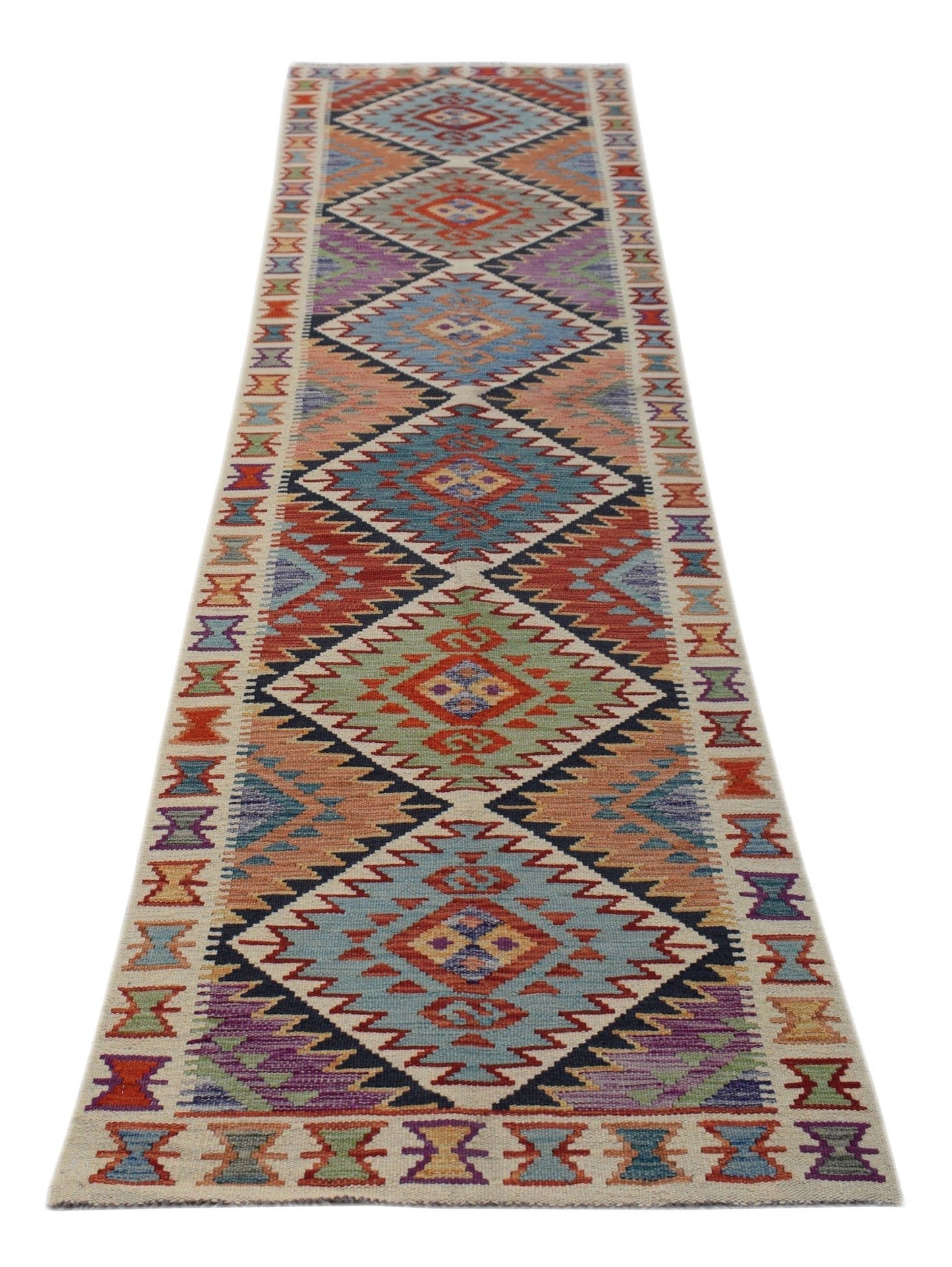 A handmade Afghan Maimana wool runner rug featuring a colorful geometric diamond pattern.