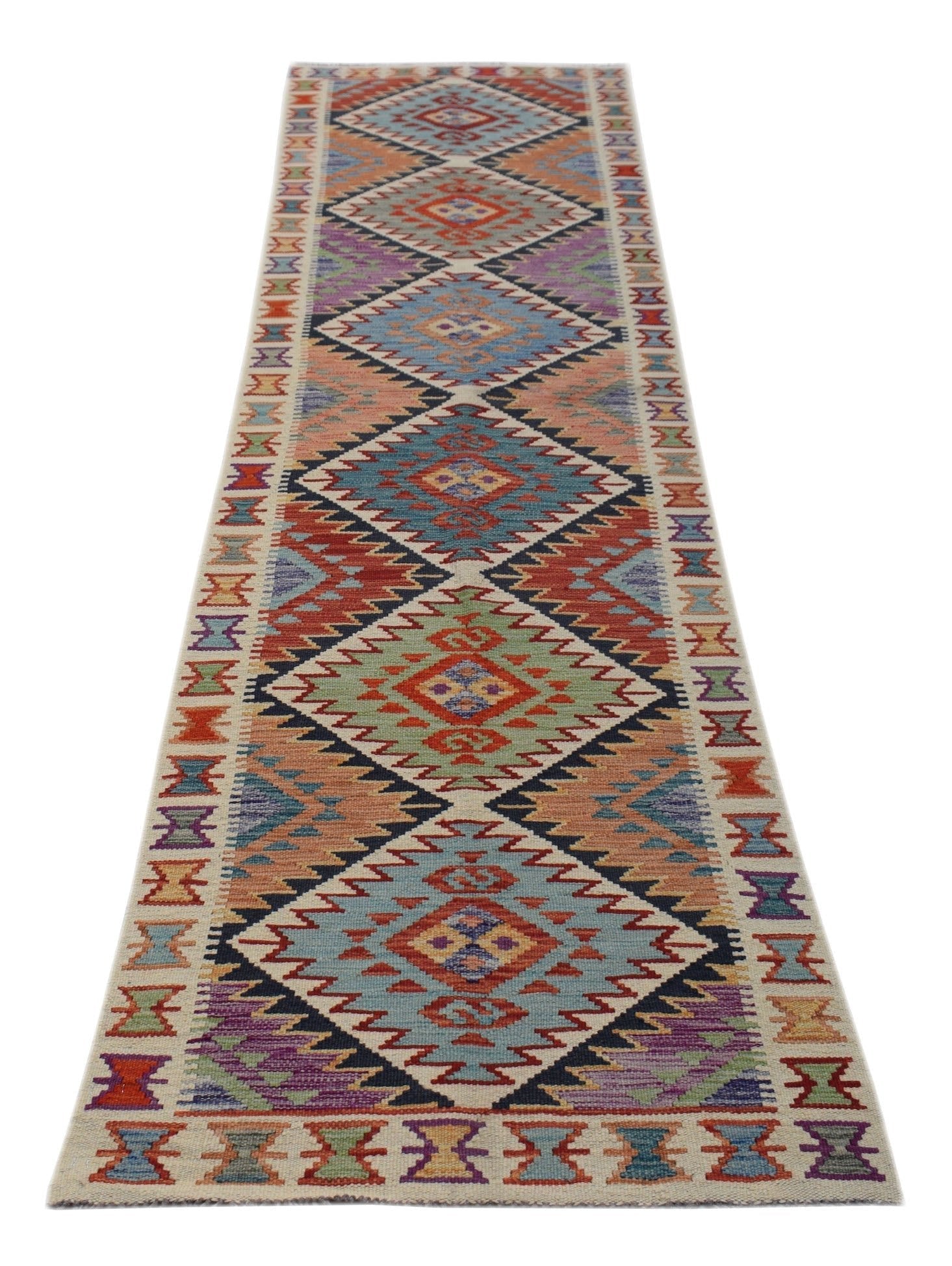 A handmade Afghan Maimana wool runner rug featuring a colorful geometric diamond pattern.