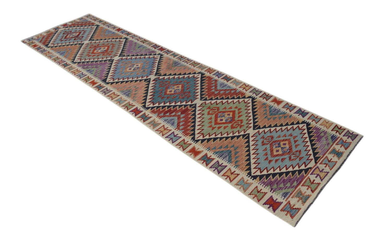 A handmade Afghan Maimana wool runner rug featuring a colorful geometric diamond pattern.