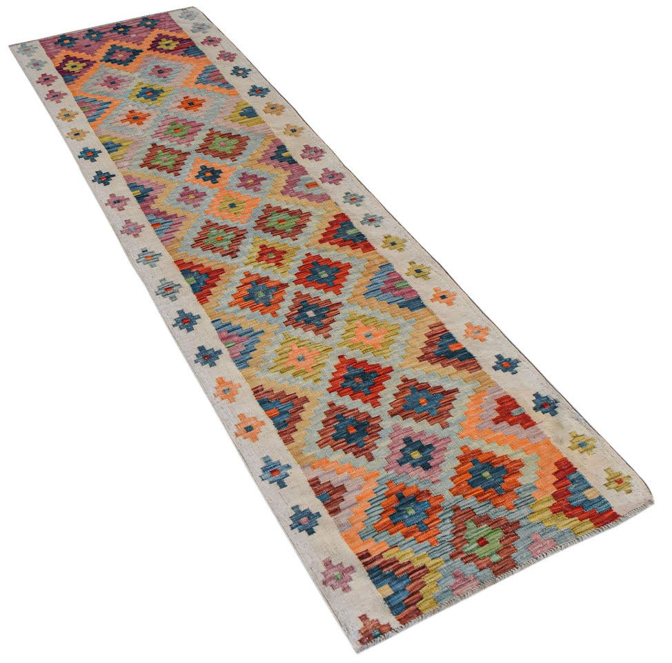 Afghan Maimana Kilim runner with geometric patterns in multiple colors.