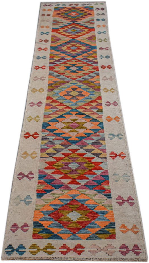 Handwoven Afghan Maimana wool runner featuring a colorful geometric diamond pattern.