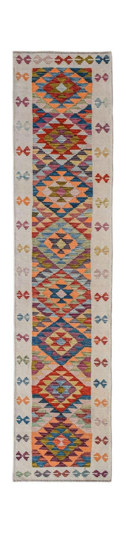 Handwoven Afghan Maimana wool runner rug featuring a colorful geometric diamond pattern.