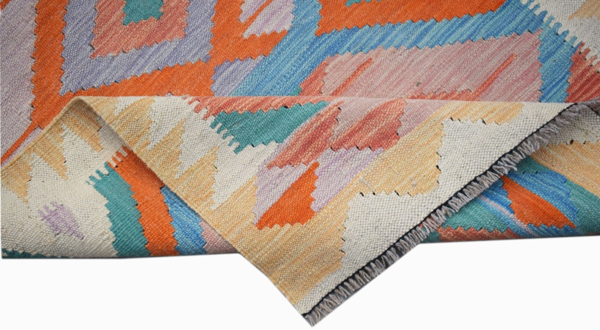 A handwoven Afghan Maimana Kilim runner featuring a colorful geometric pattern on wool.