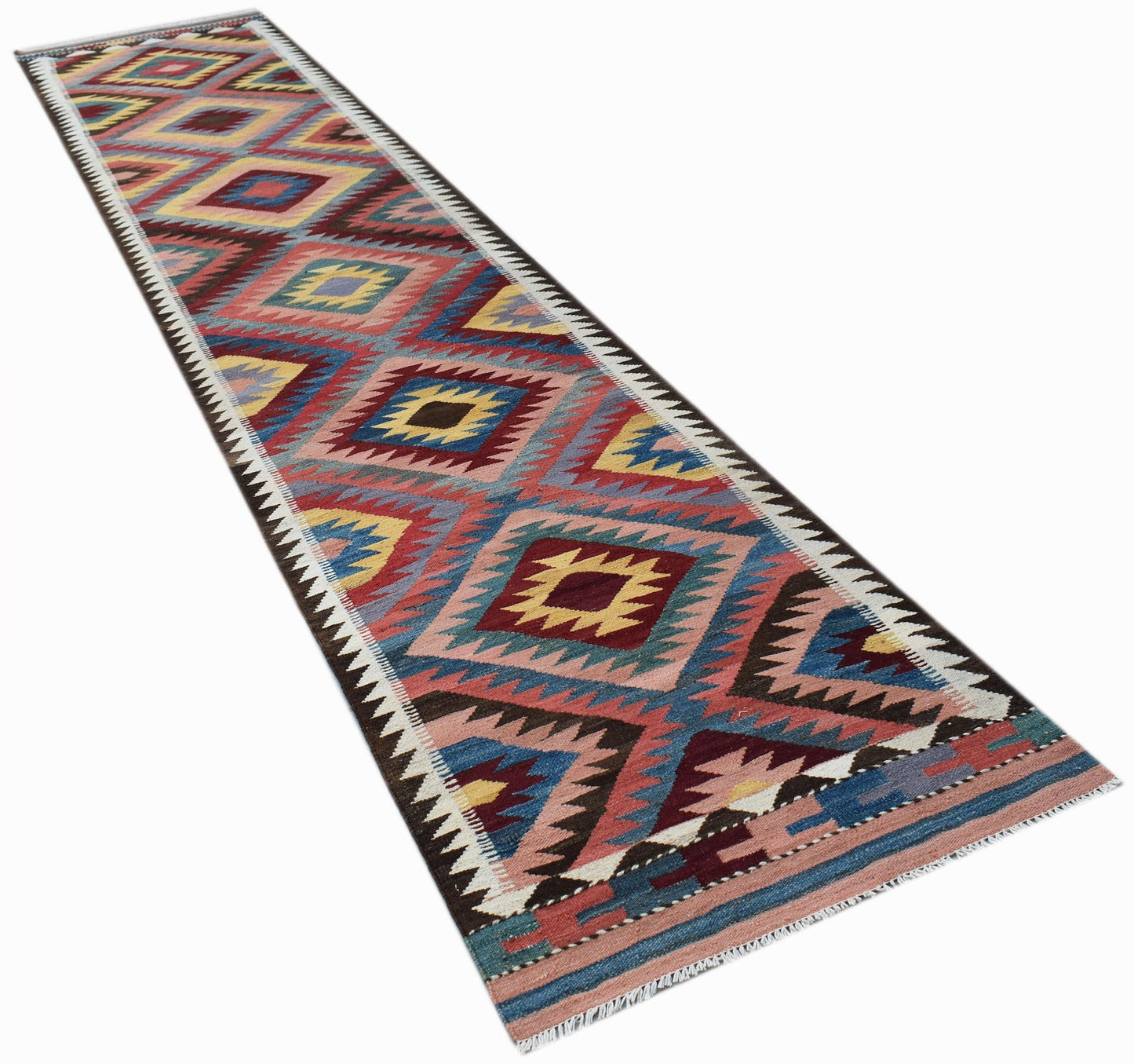 A handmade Afghan Maimana wool runner rug featuring a colorful geometric diamond pattern.