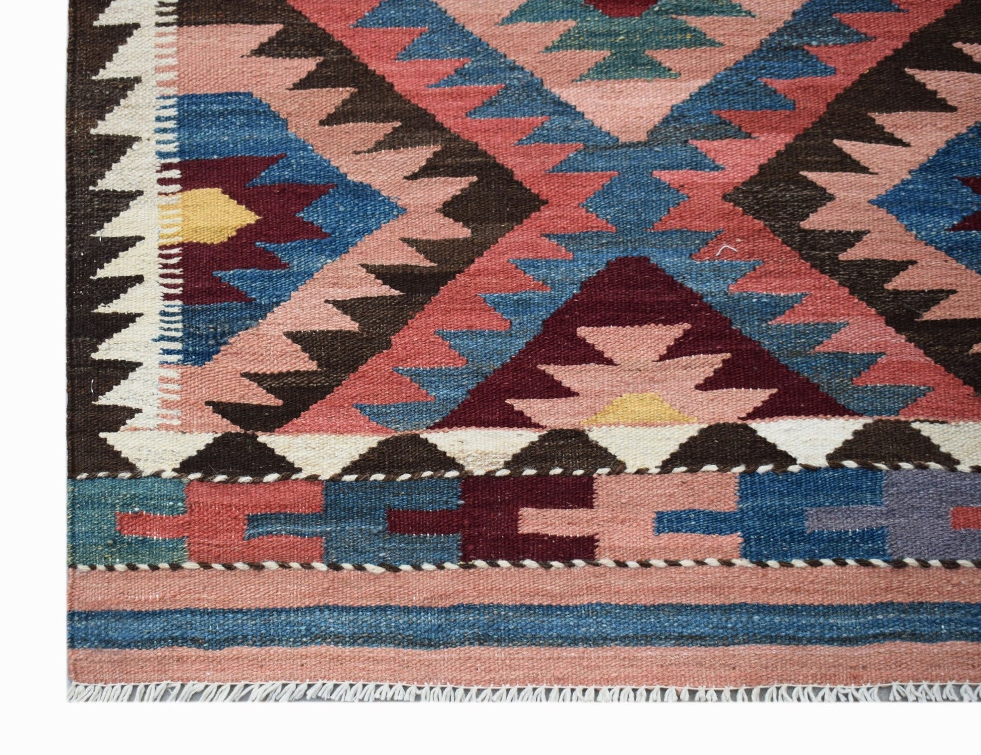 Handwoven Afghan Maimana wool kilim runner featuring geometric patterns in pink, blue, and brown.