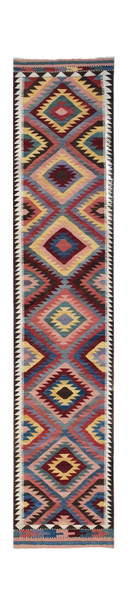 Handwoven Afghan Maimana wool runner featuring a colorful geometric diamond pattern.