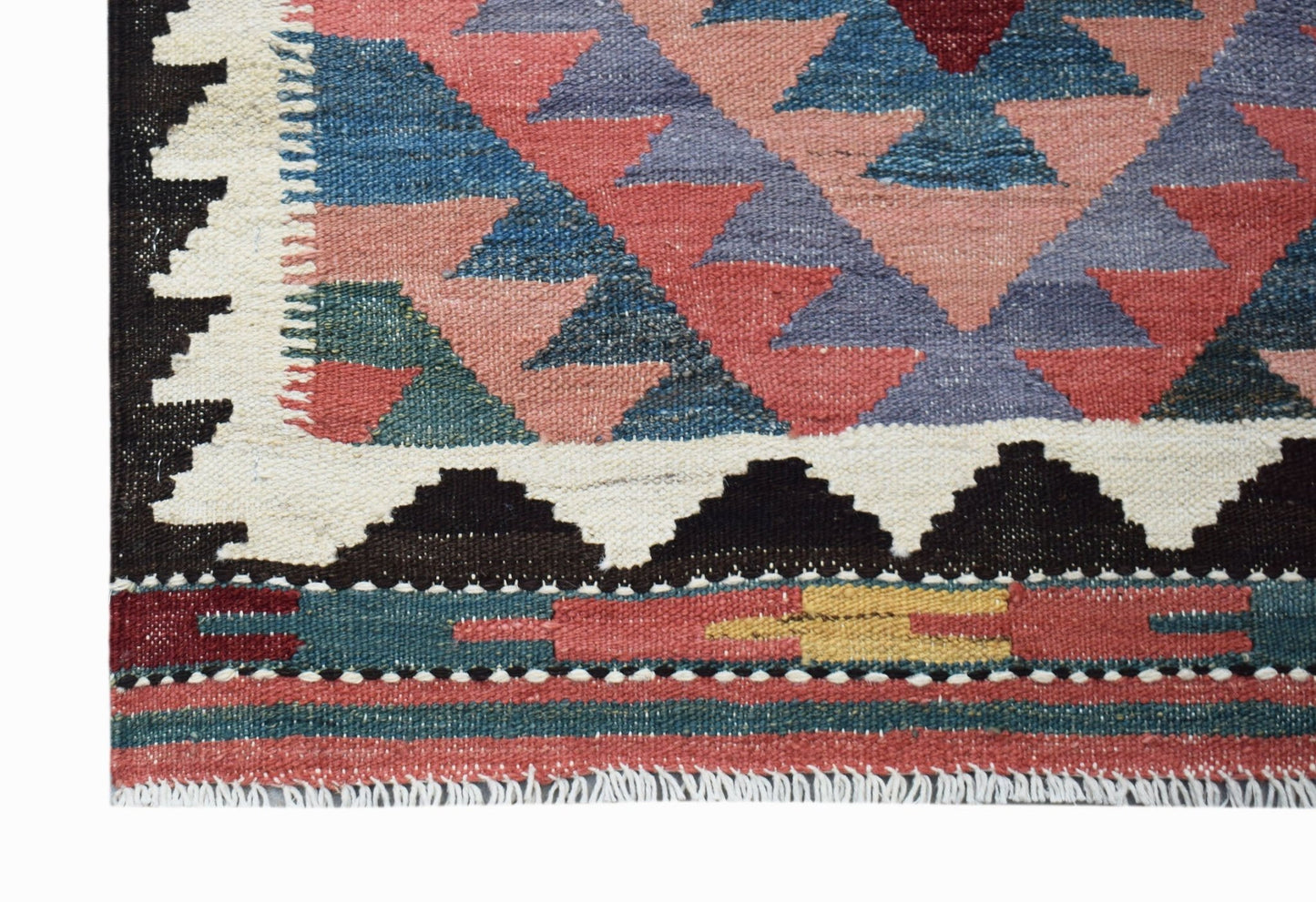 A handmade Afghan Maimana kilim runner featuring geometric patterns in red, blue, and yellow.