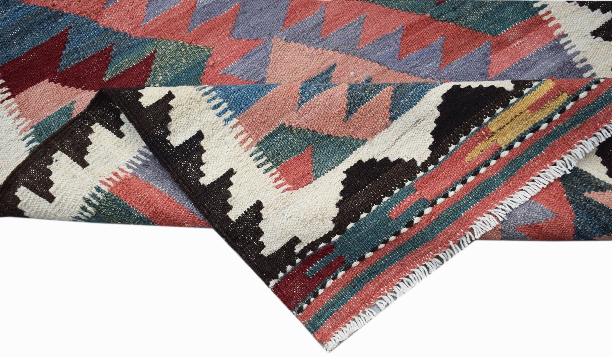 A handwoven Afghan Maimana kilim runner featuring geometric patterns in red, blue, and cream.
