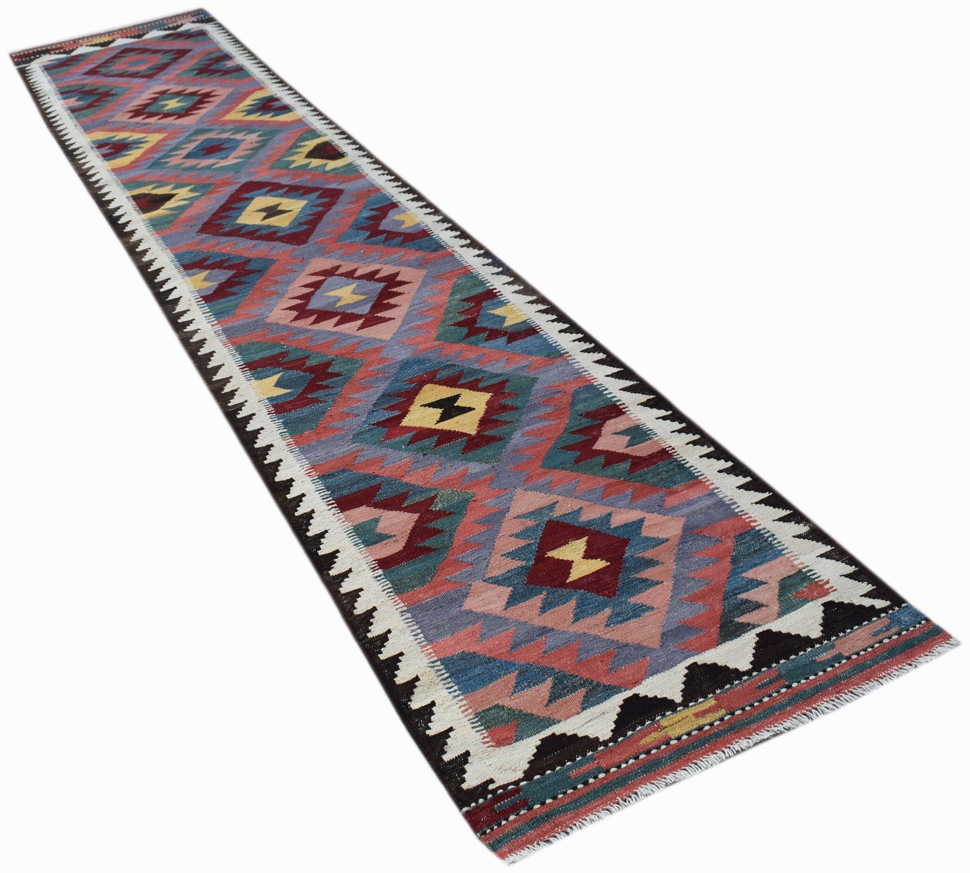 A handmade Afghan Maimana wool runner rug featuring a colorful geometric diamond pattern.