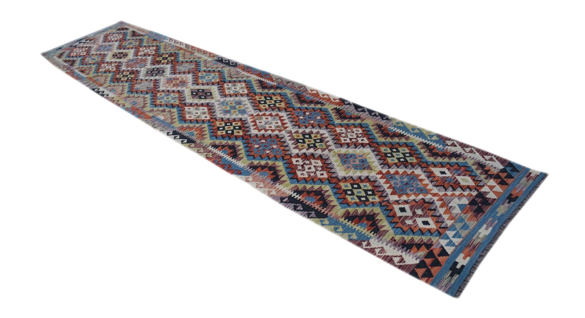 A long, handmade Afghan Maimana wool runner rug featuring a colorful geometric diamond pattern.