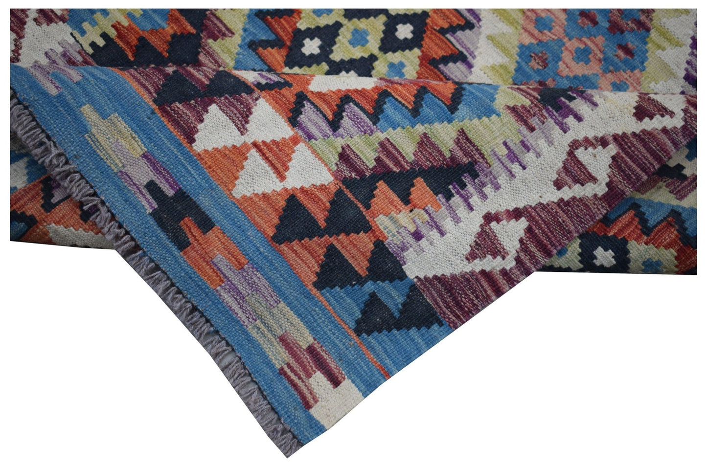 A handwoven Afghan Maimana wool kilim runner featuring a colorful geometric pattern.