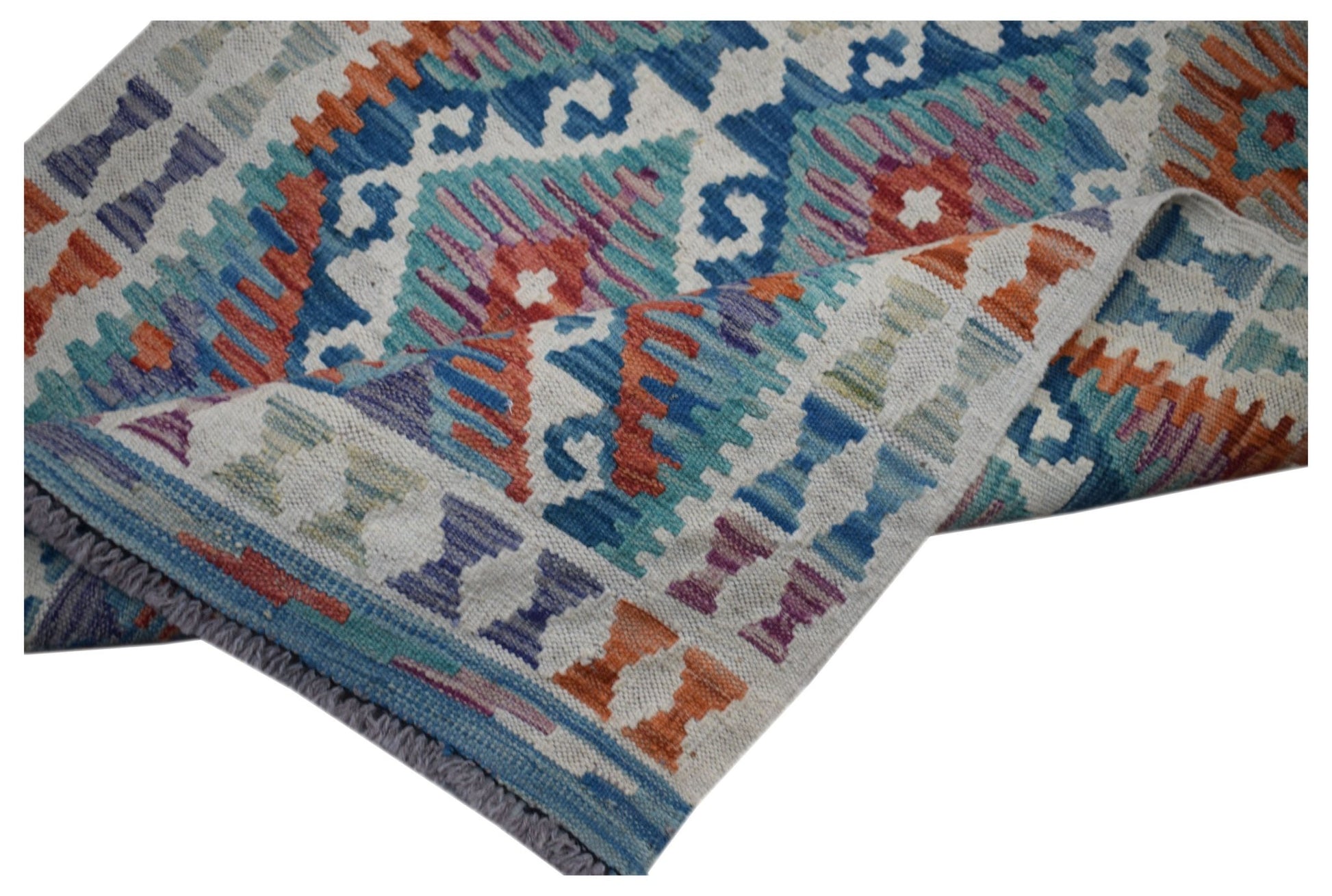 Handwoven Afghan Maimana kilim runner featuring a geometric pattern in vibrant multicolored wool.