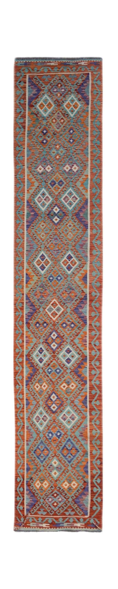 A handmade Afghan Maimana wool runner rug featuring a geometric pattern in orange and blue tones.