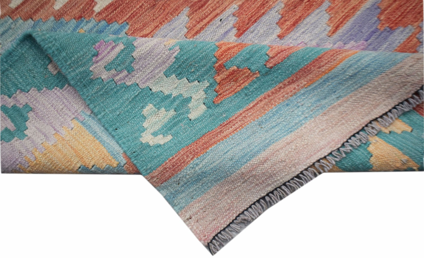 A handwoven Afghan Maimana kilim runner featuring a geometric pattern in vibrant multicolored wool.