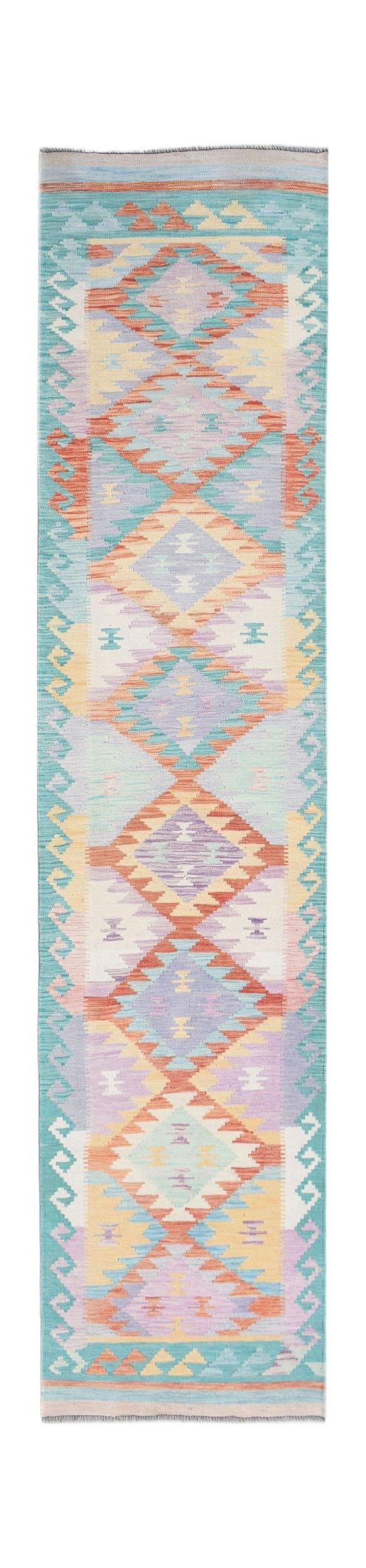 A handmade Afghan Maimana wool runner rug featuring a colorful geometric diamond pattern.