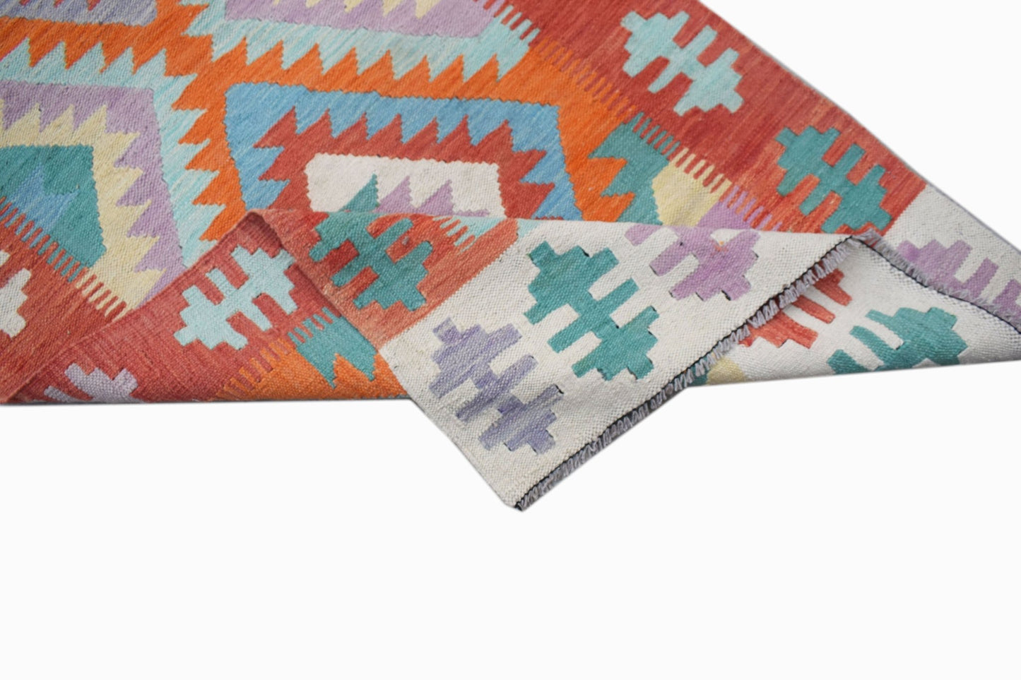 A handmade Afghan Maimana kilim runner featuring a geometric pattern in orange, blue, and purple.