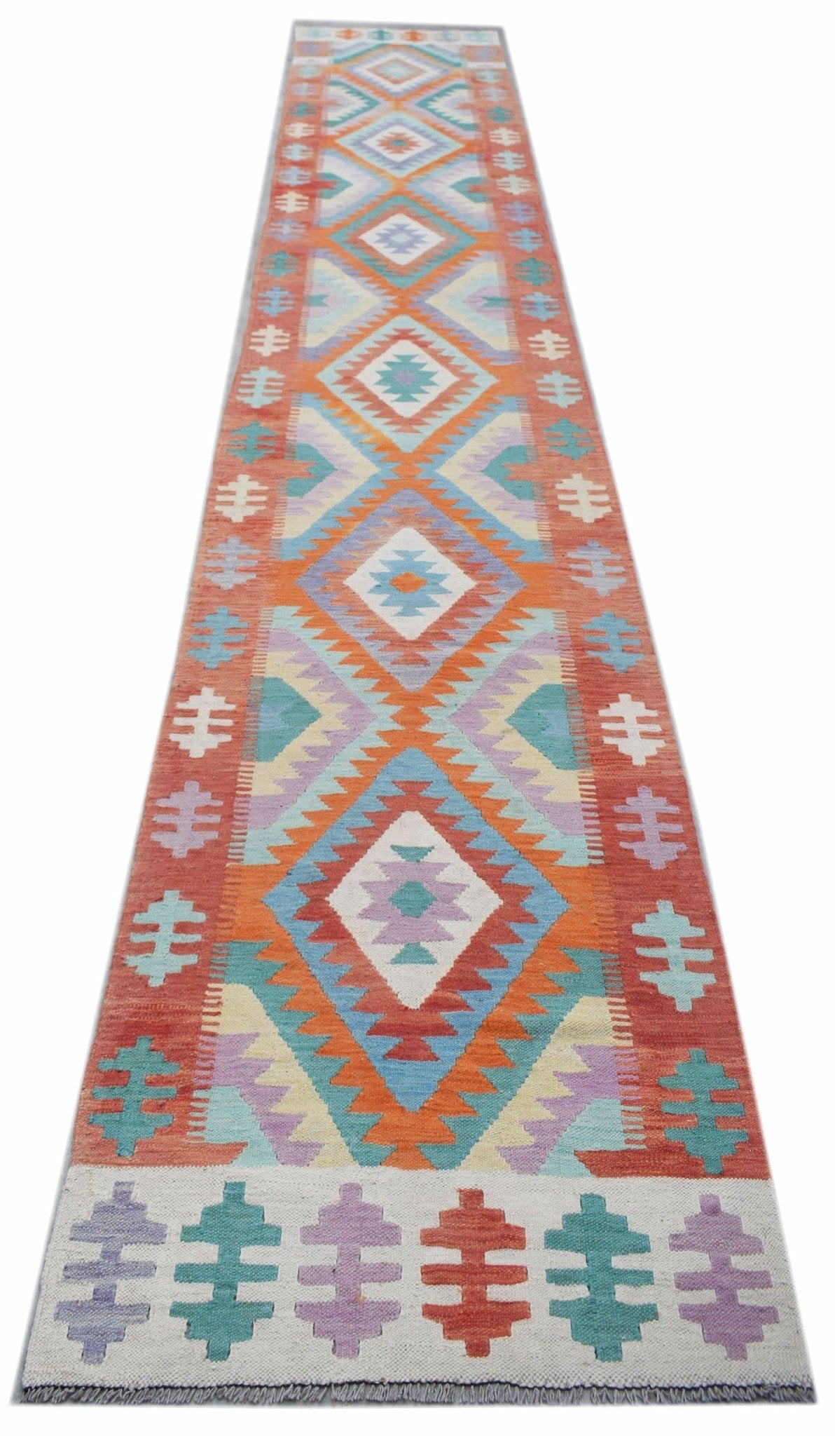Handwoven Afghan Maimana wool runner featuring a colorful geometric diamond pattern.