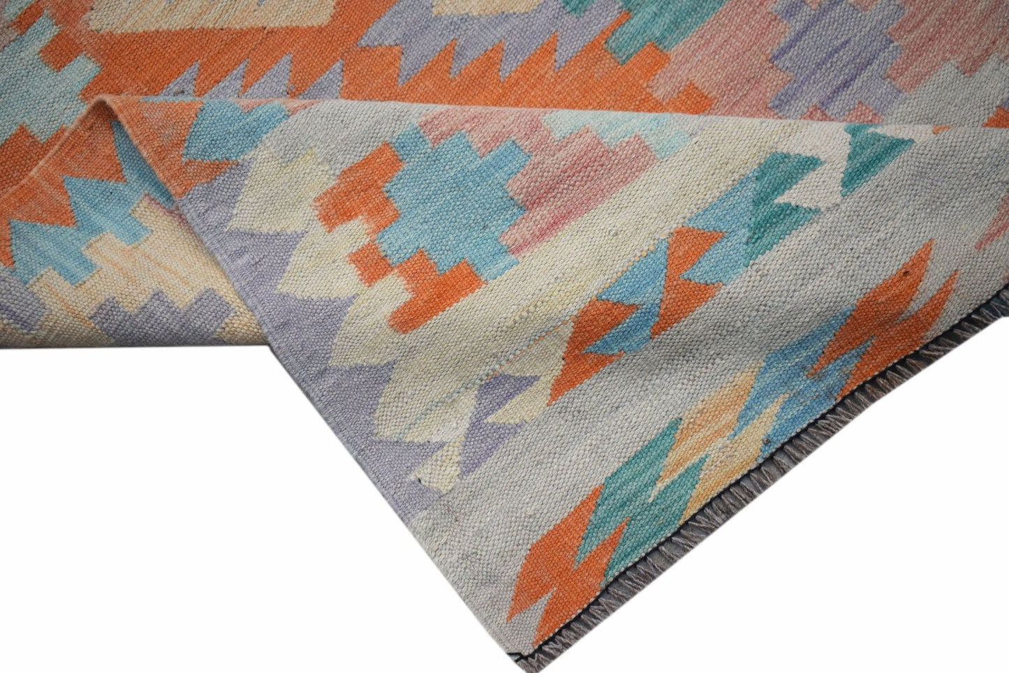 Handwoven Afghan Maimana wool runner featuring a geometric pattern in orange, blue, and cream.