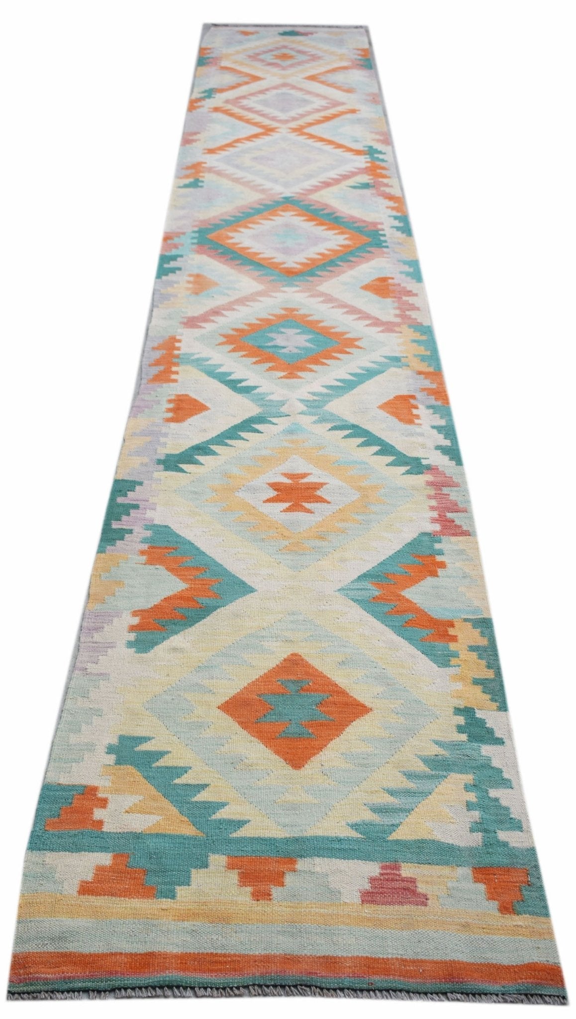 Handwoven Afghan Maimana wool runner rug featuring a colorful geometric diamond pattern.