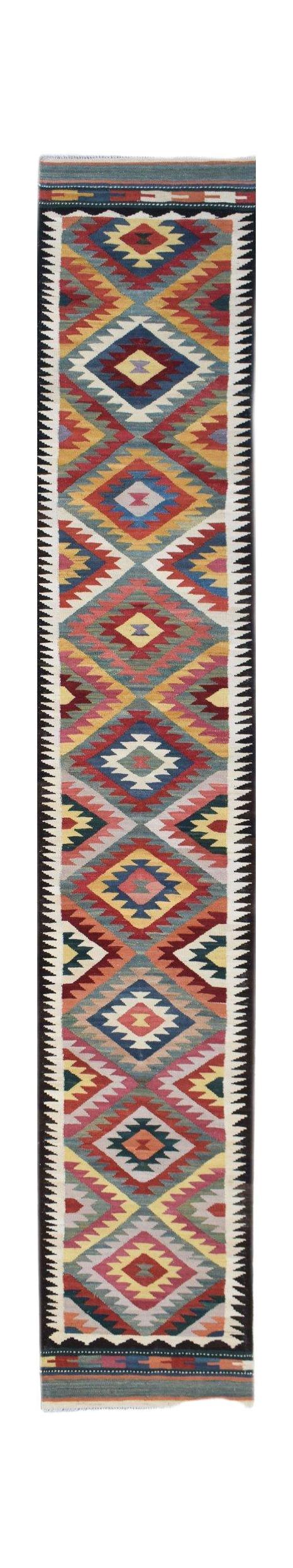 Handwoven Afghan Maimana wool runner rug featuring a colorful geometric diamond pattern.