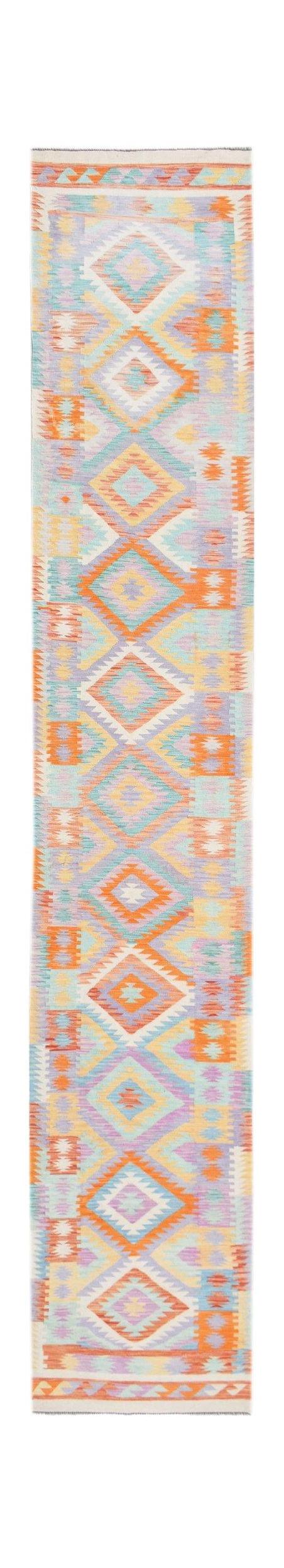 A handmade Afghan Maimana wool runner rug featuring a colorful geometric diamond pattern.