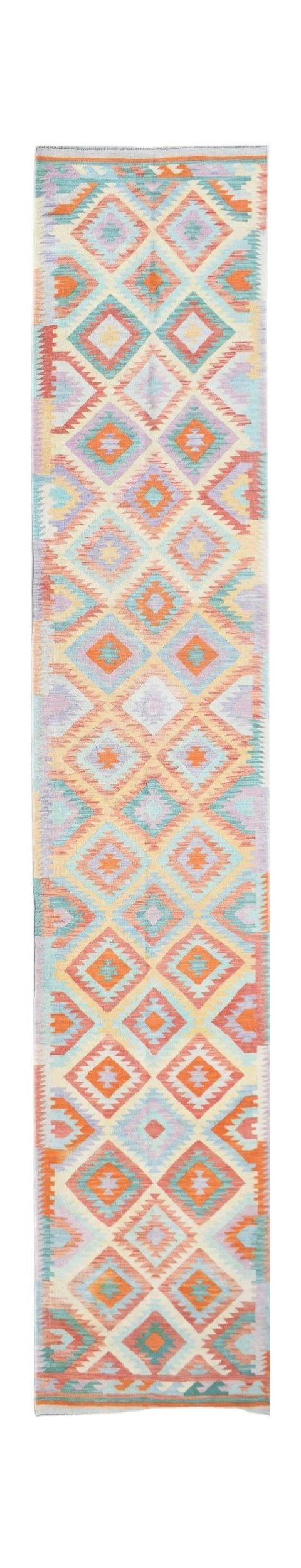 A handmade Afghan Maimana wool runner rug featuring a colorful geometric diamond pattern.