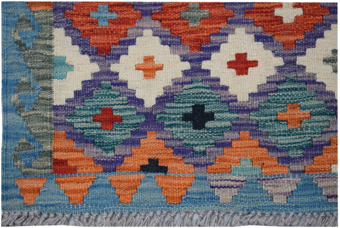 Handwoven Afghan Maimana kilim rug featuring a colorful geometric diamond pattern in wool.