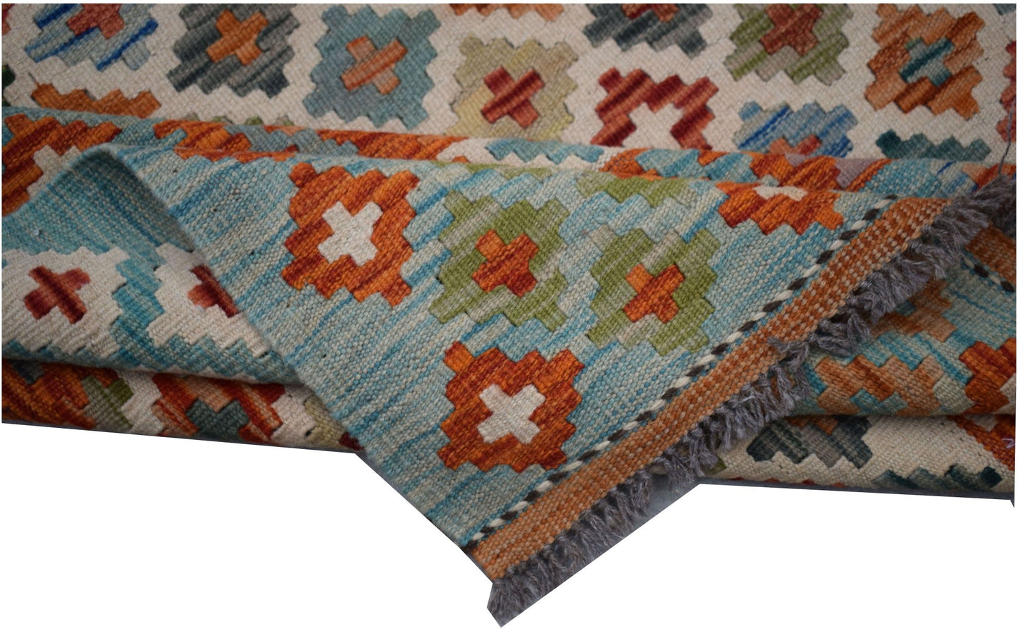 Handwoven Afghan Maimana kilim rug featuring a geometric pattern in blue, orange, and green wool.