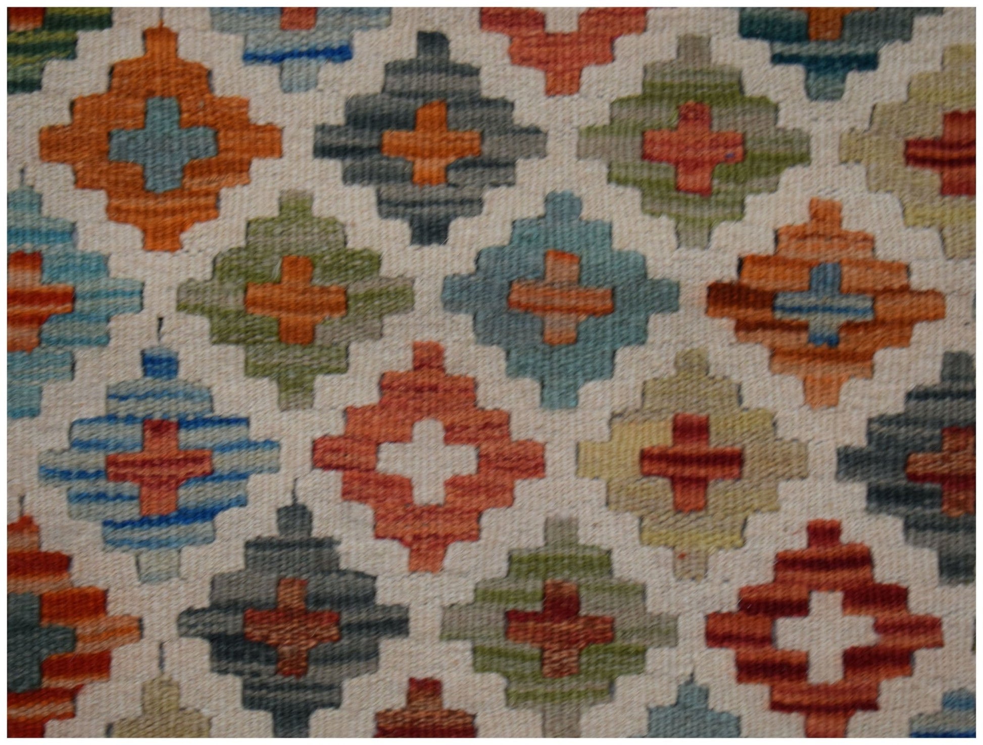 Handwoven Afghan Maimana kilim rug featuring a repeating geometric diamond pattern in multi-colors.
