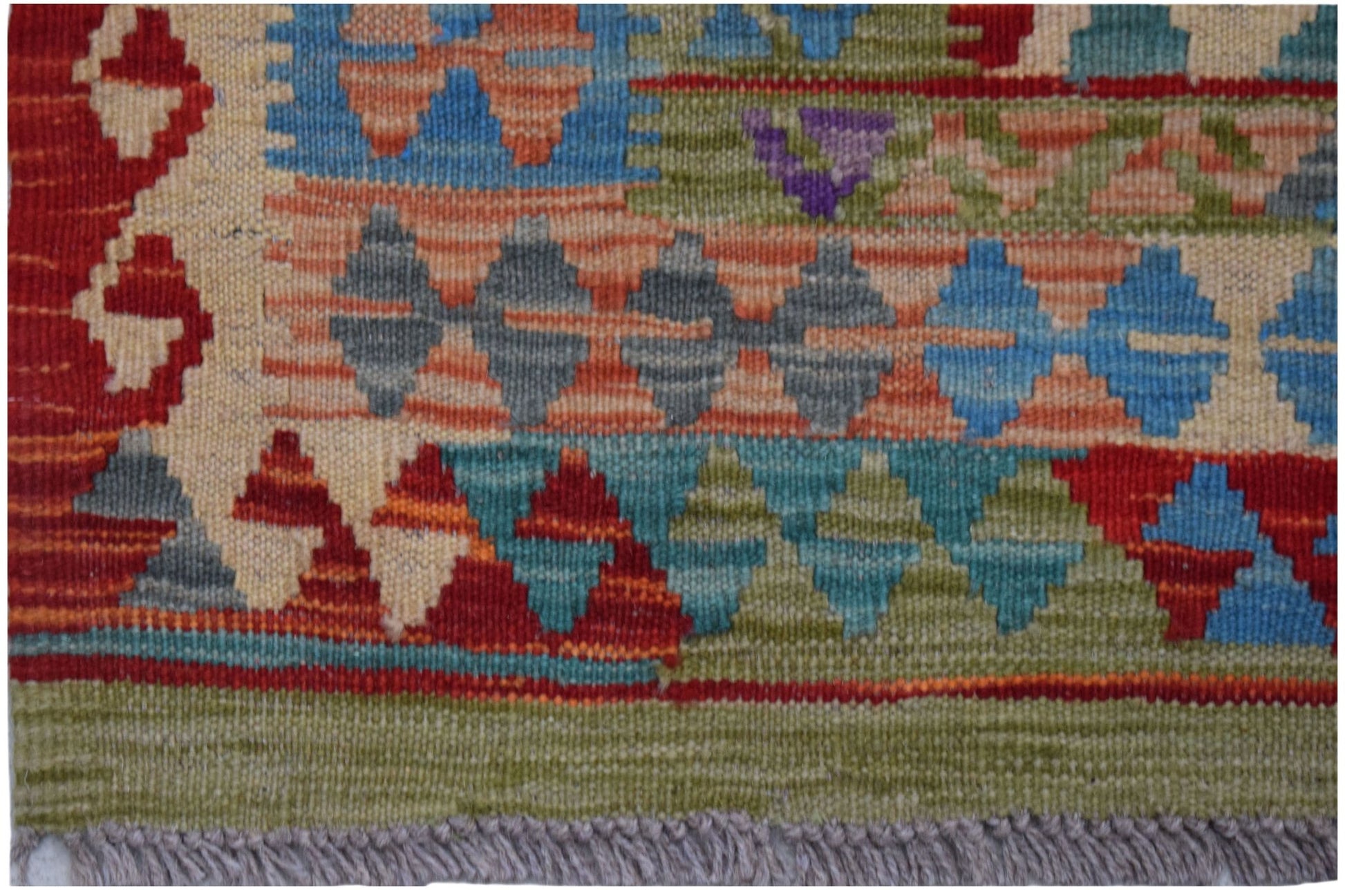 Handwoven Afghan Maimana kilim rug featuring a geometric pattern in vibrant multicolored wool.