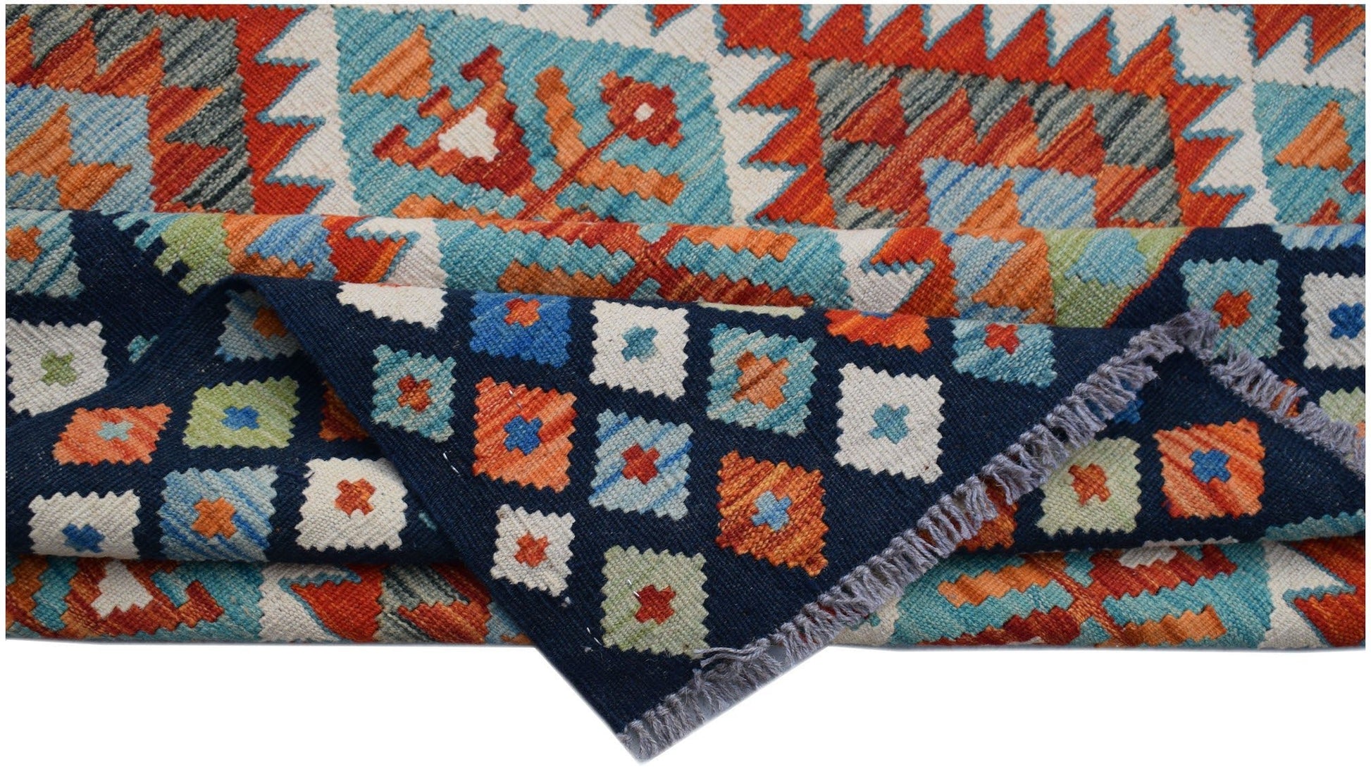 A handmade Afghan Maimana kilim rug featuring geometric patterns in blue, orange, and cream.