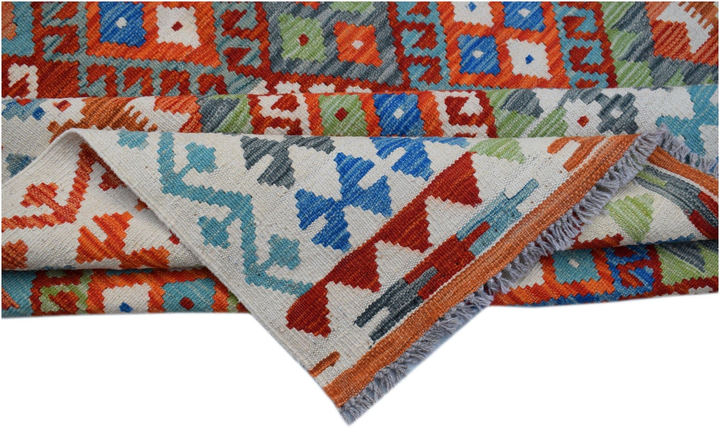 A handmade Afghan Maimana kilim rug featuring vibrant geometric patterns in wool.
