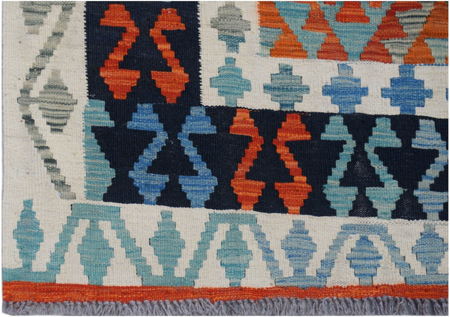 Handwoven Afghan Maimana kilim rug featuring geometric patterns in blue, orange, and cream.