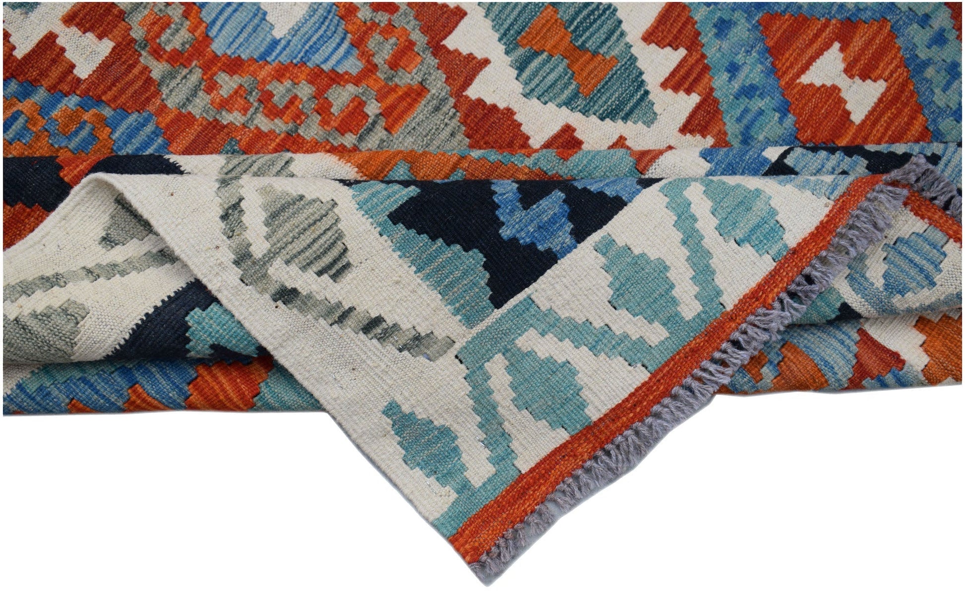 A handmade Afghan Maimana kilim rug featuring geometric patterns in orange, blue, and cream.