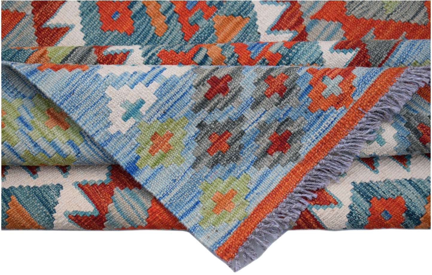 A handwoven Afghan Maimana kilim rug featuring a geometric pattern in vibrant orange and blue.