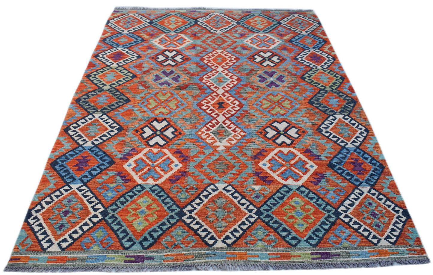 Handmade Afghan Maimana kilim rug featuring a vibrant geometric pattern in wool.