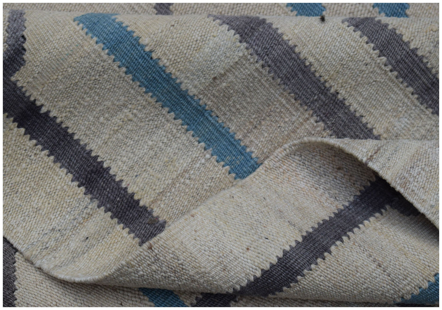 Handwoven Afghan Maimana kilim rug featuring a geometric striped pattern in blue and grey wool.