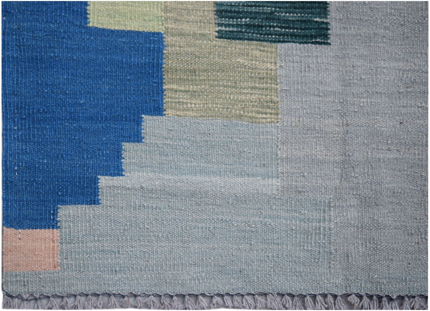 Handwoven Afghan Maimana kilim rug featuring a geometric pattern in blue, grey, and green tones.