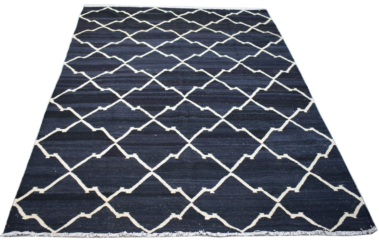 Handwoven Afghan Maimana kilim rug featuring a dark blue field with a white geometric lattice.
