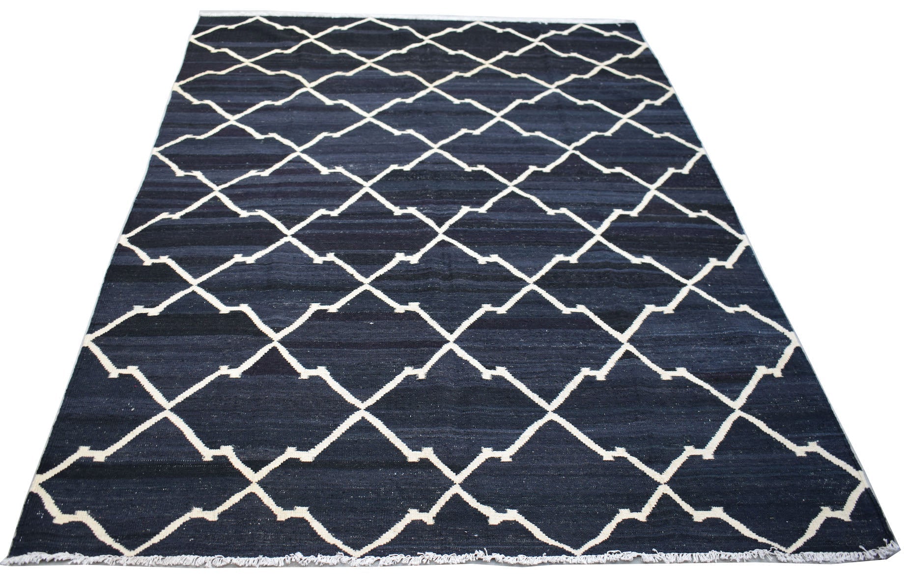 Handwoven Afghan Maimana kilim rug featuring a dark blue field with a white geometric lattice.