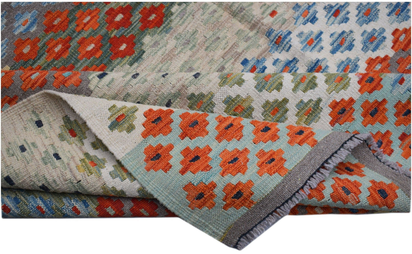 Handwoven Afghan Maimana kilim rug featuring a geometric pattern in orange, blue, and green.