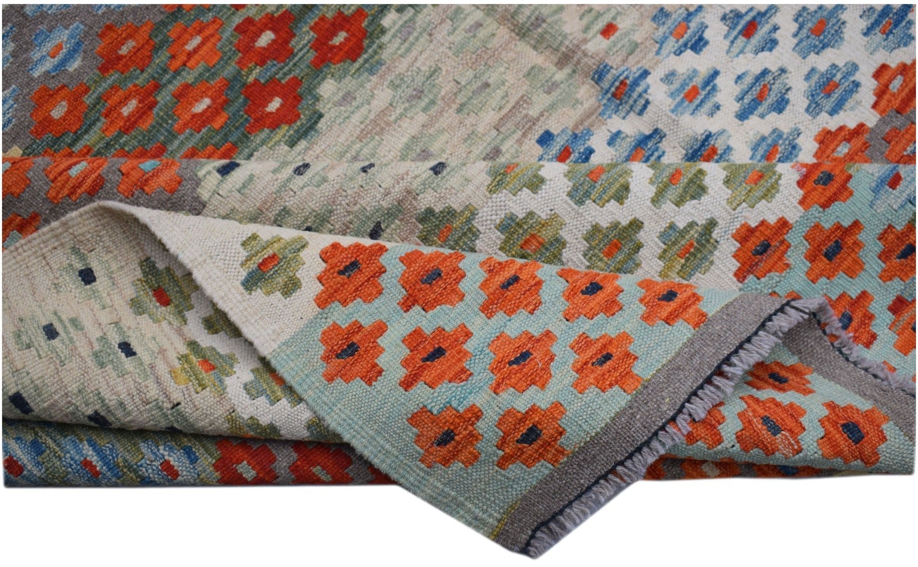 Handwoven Afghan Maimana kilim rug featuring a geometric pattern in orange, blue, and green.