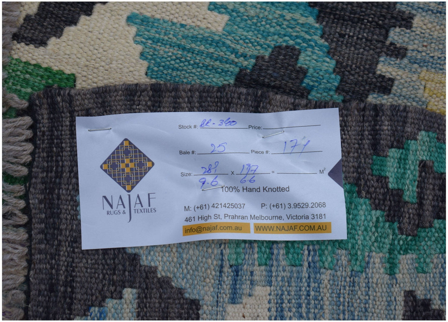 A handmade Afghan Maimana kilim featuring a geometric pattern in blue, green, and cream tones.