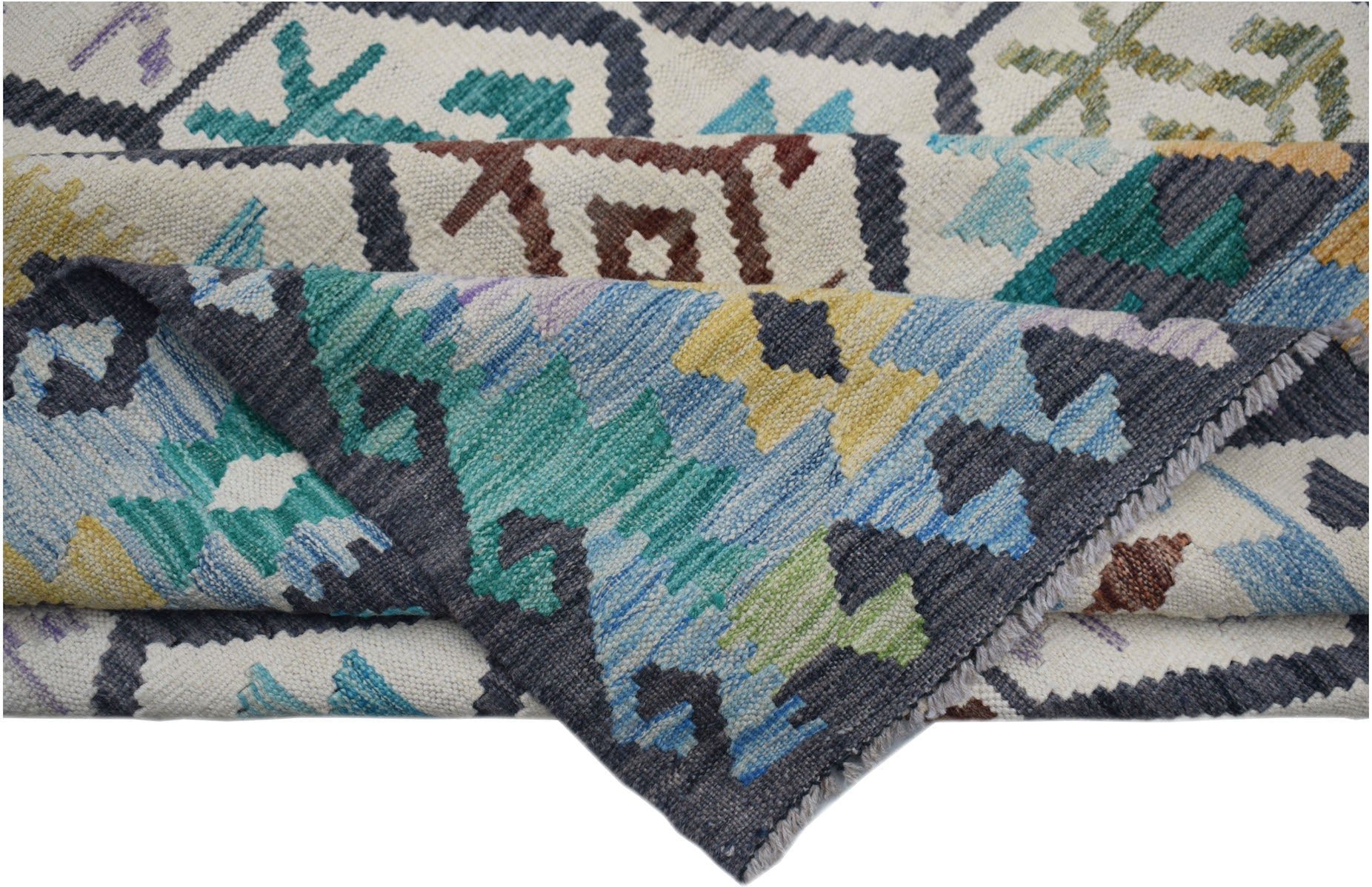 A handwoven Afghan Maimana kilim rug featuring a colorful geometric pattern on a cream background.