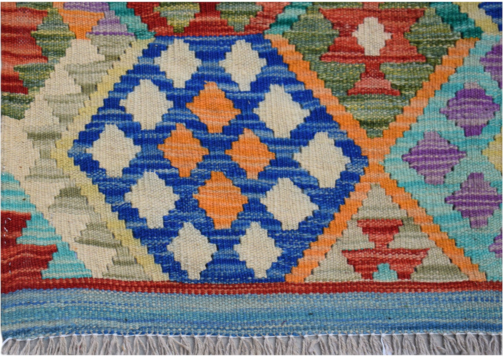 Handwoven Afghan Maimana kilim rug featuring a vibrant geometric pattern in wool.