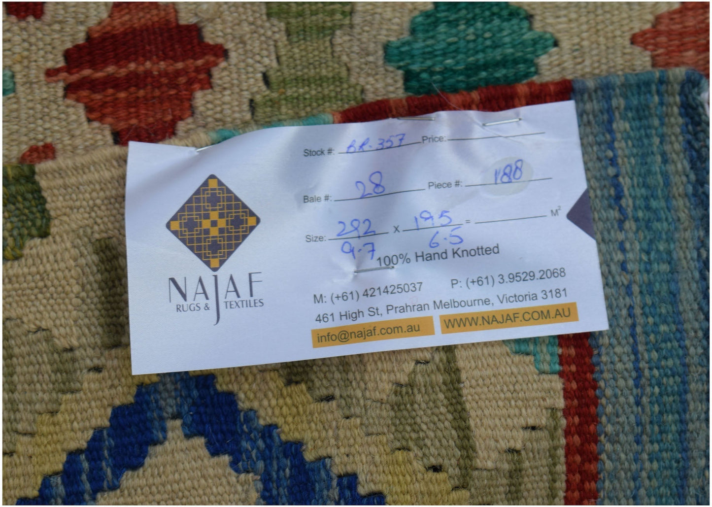 A flatwoven Afghan Maimana kilim featuring a colorful geometric pattern.