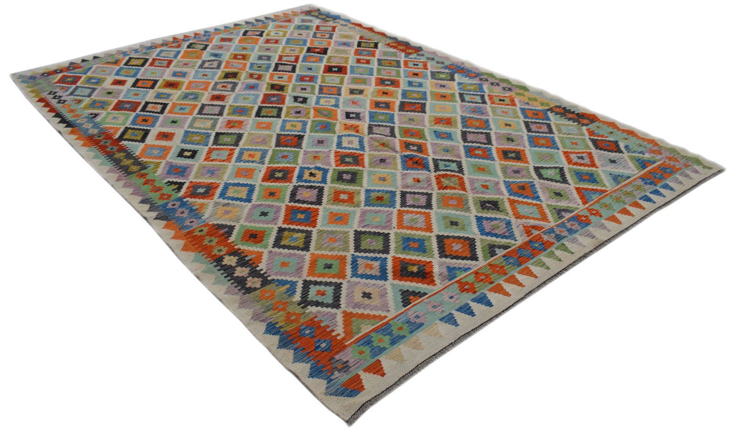 Handwoven Afghan Maimana kilim rug featuring a colorful geometric diamond pattern.
