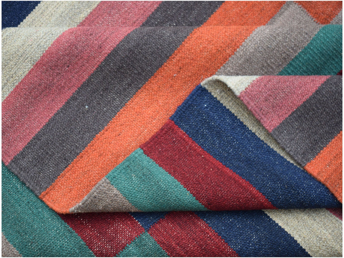 Handwoven Afghan Maimana kilim rug featuring a vibrant, multi-colored striped pattern.