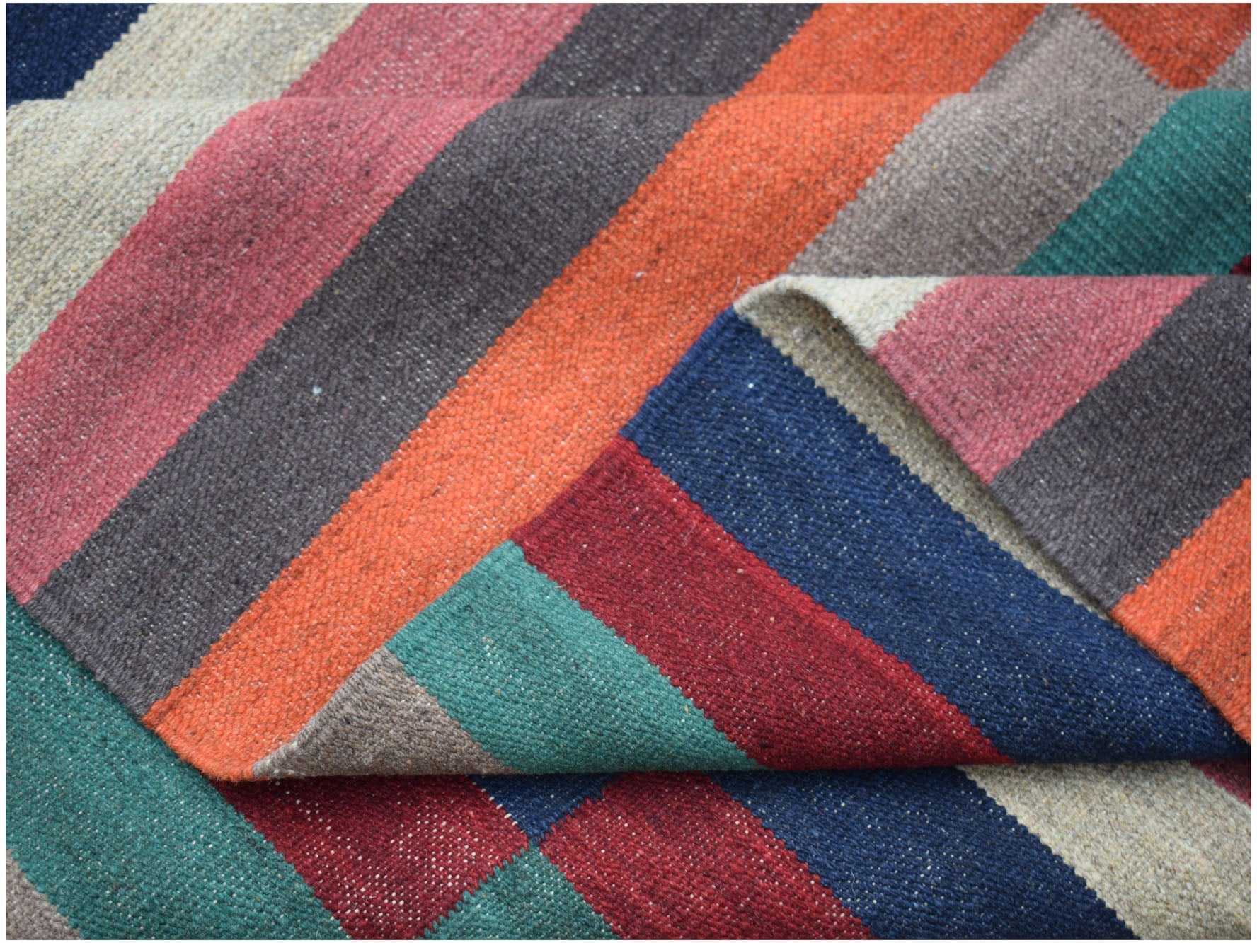 Handwoven Afghan Maimana kilim rug featuring a vibrant, multi-colored striped pattern.